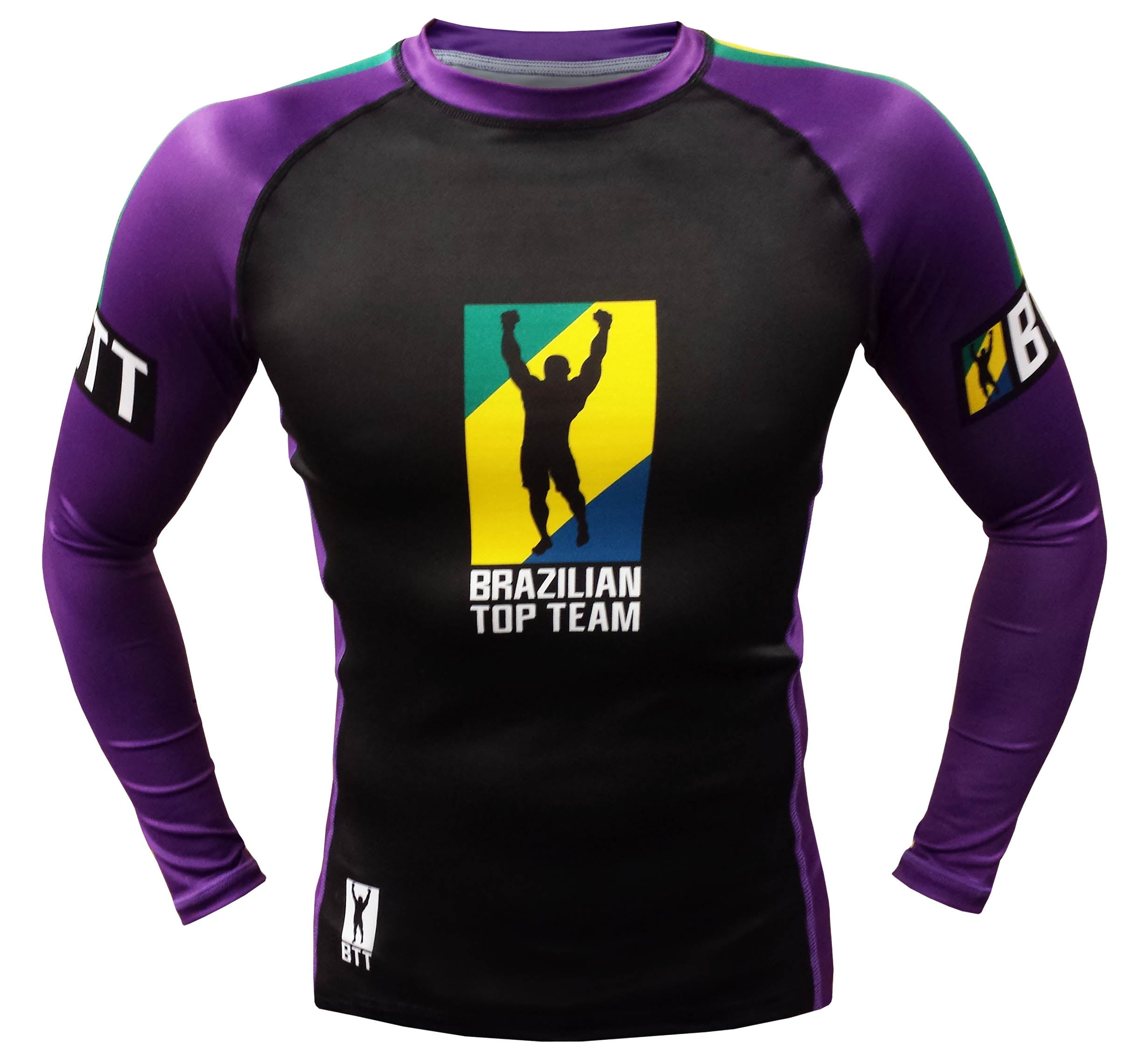The BTT Ranked Long Sleeve Women’s Rashguard features purple sleeves, a black front, and the Brazilian Top Team logo with a silhouette of raised arms against a yellow and blue background.