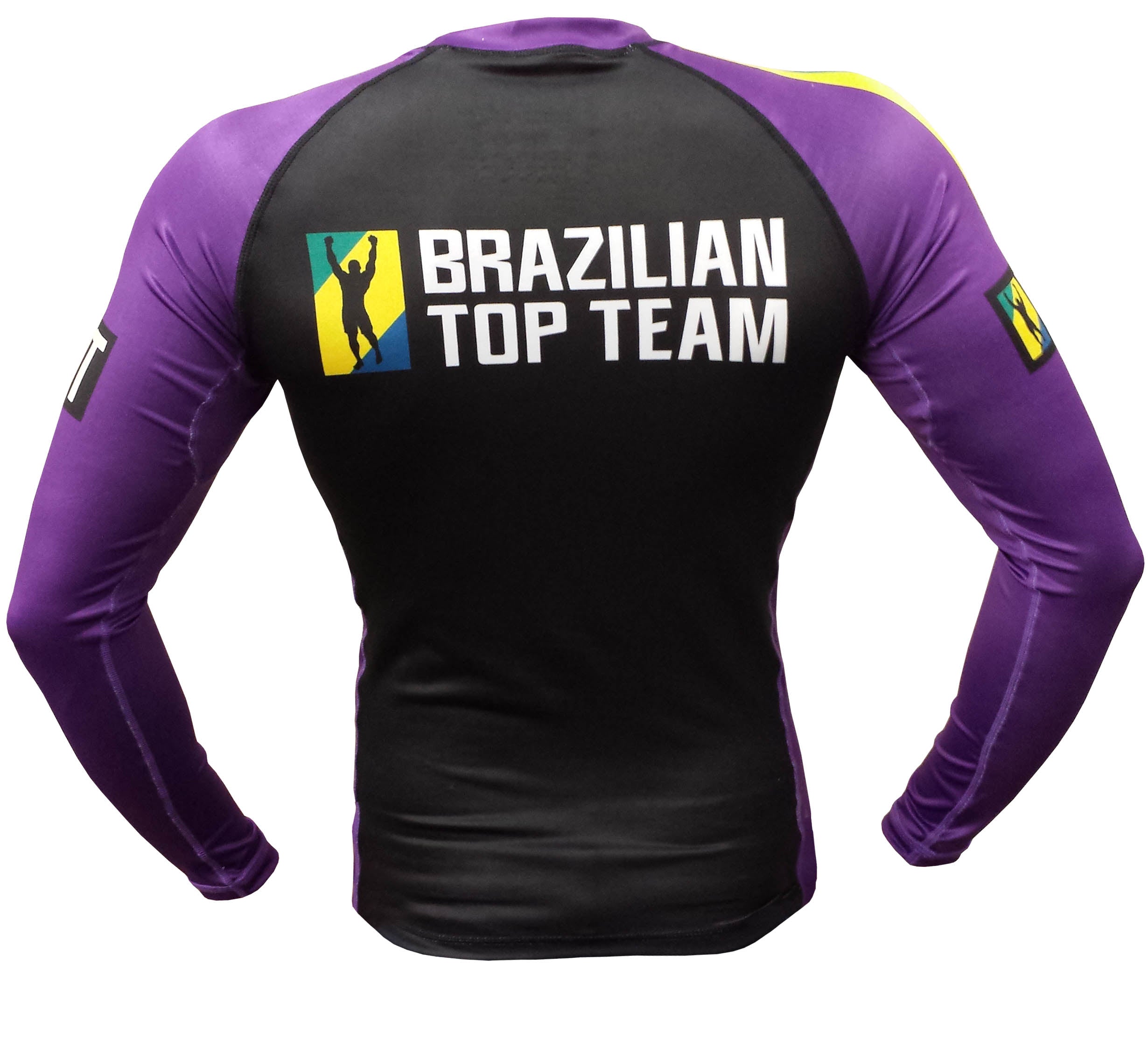 The BTT Ranked Long Sleeve Womens Rashguard is a purple and black athletic shirt with "Brazilian Top Team" and a silhouette logo on the upper back, shown from the back.