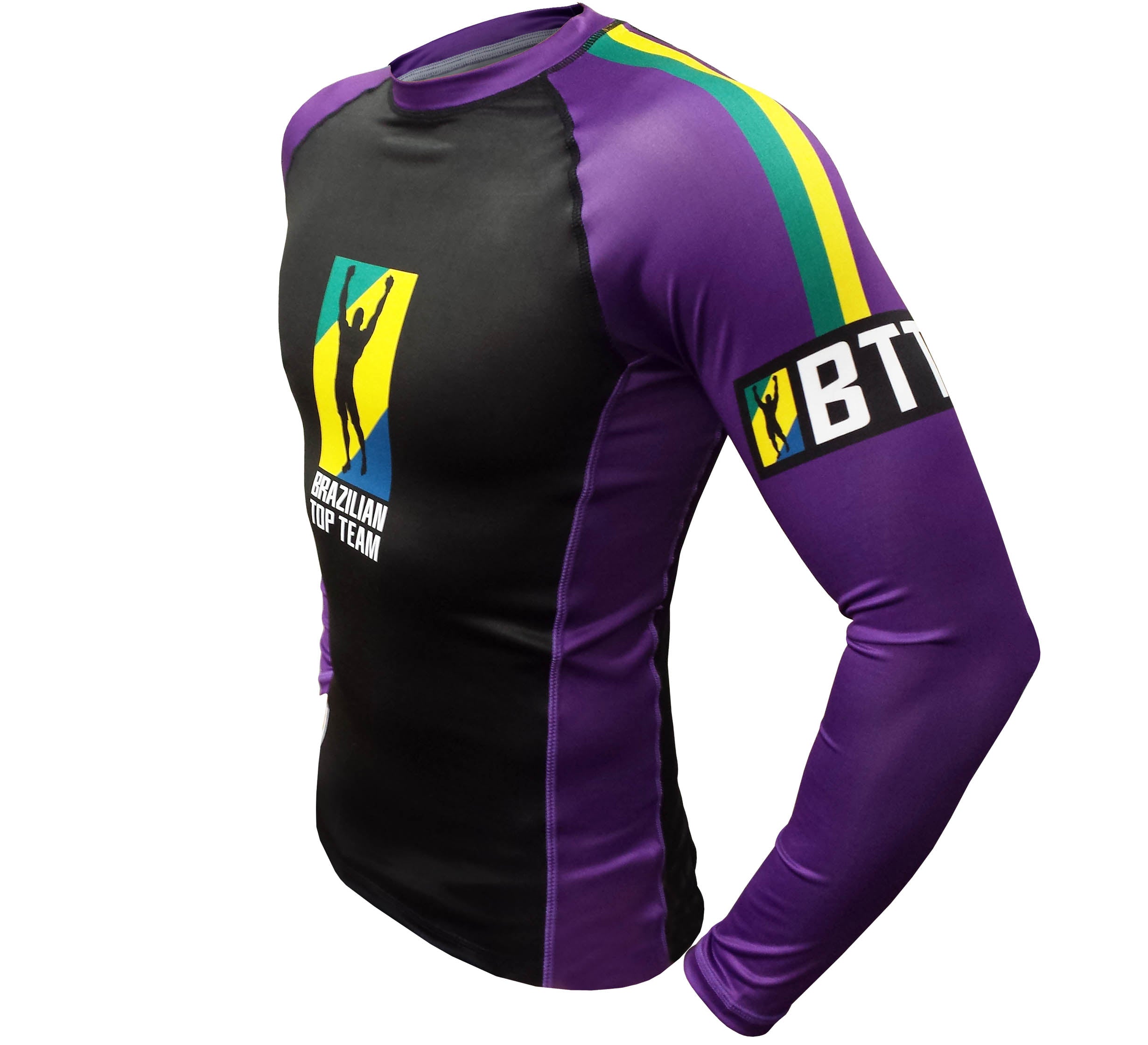 The BTT Ranked Long Sleeve Womens Rashguard features a black front, purple sleeves, the Brazilian Top Team logo on the chest, and a yellow, green, and blue striped armband with "BTT" on the left arm.