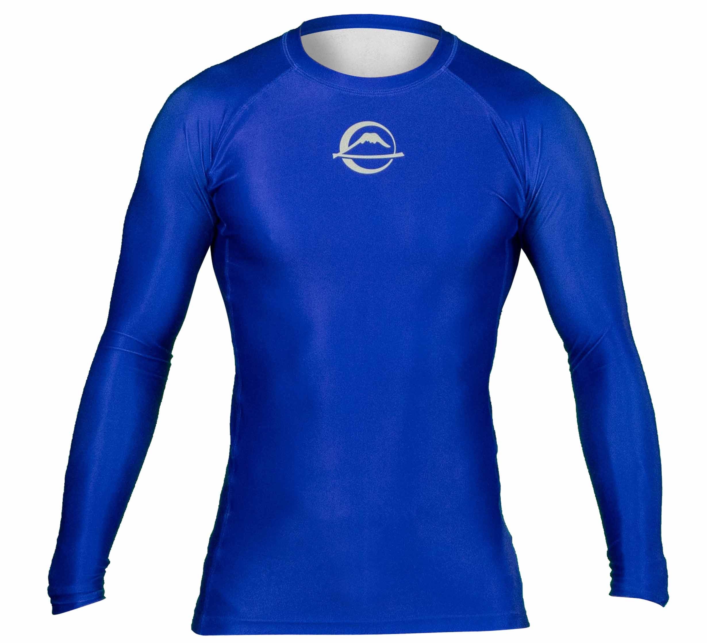The Baseline Ranked Long Sleeve Rashguard Blue is a fitted, royal blue athletic shirt with long sleeves and a small white mountain and ring logo on the chest, shown against a plain white background.