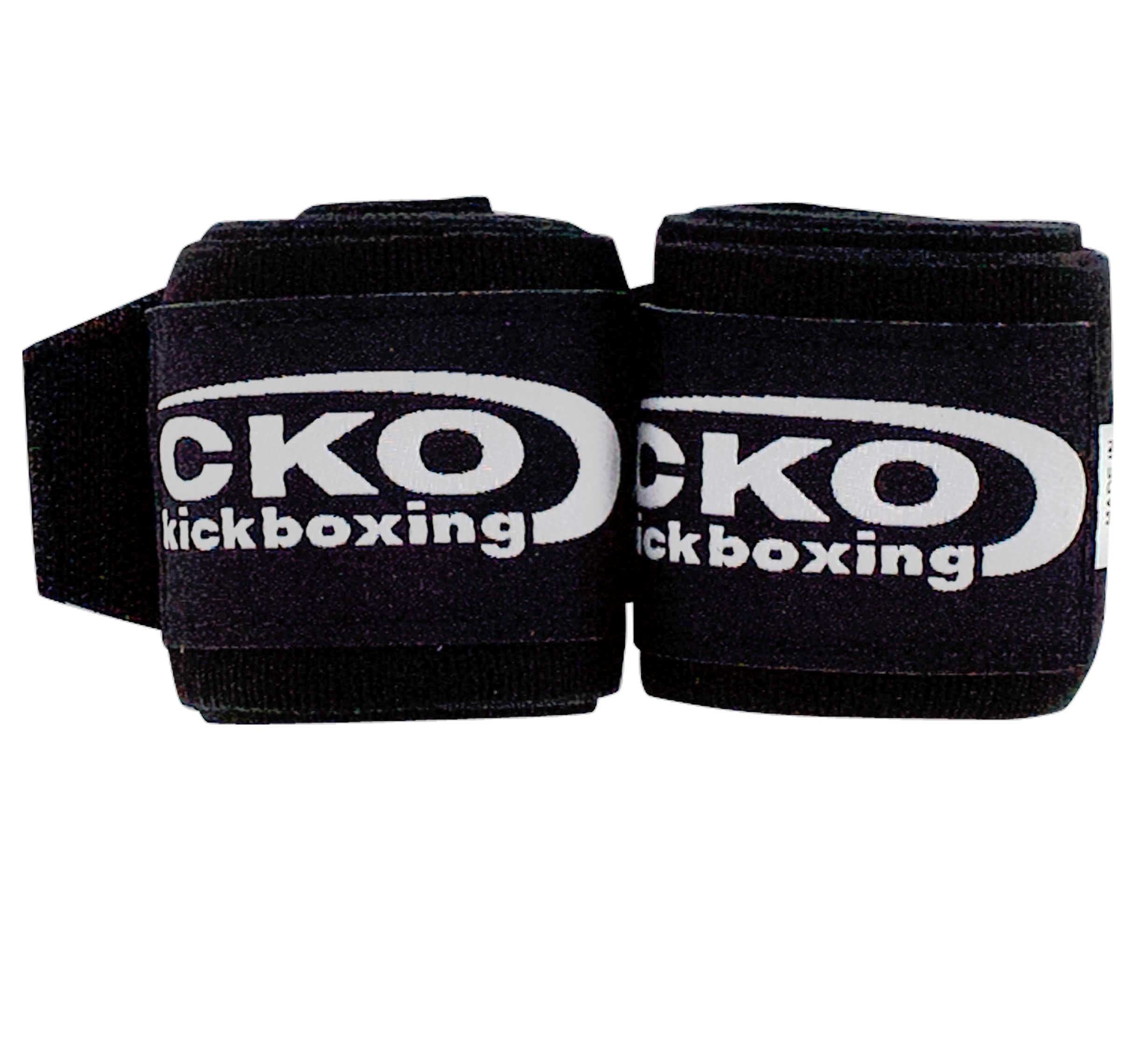 Two CKO Hand Wraps Black are rolled up side by side. "CKO kickboxing" is printed in white letters on the visible sides.