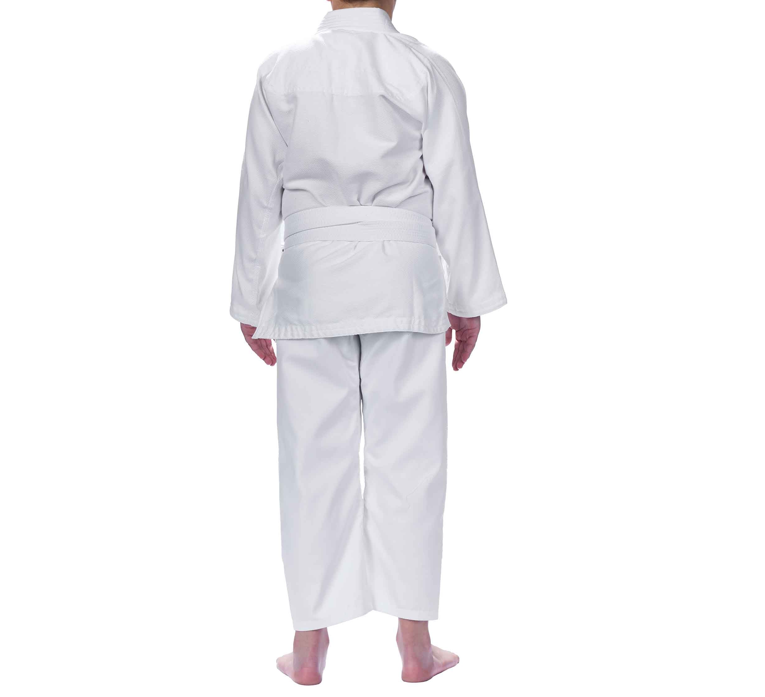 A child wearing the Starter Kids BJJ Gi White is seen from behind, standing barefoot against a white background.