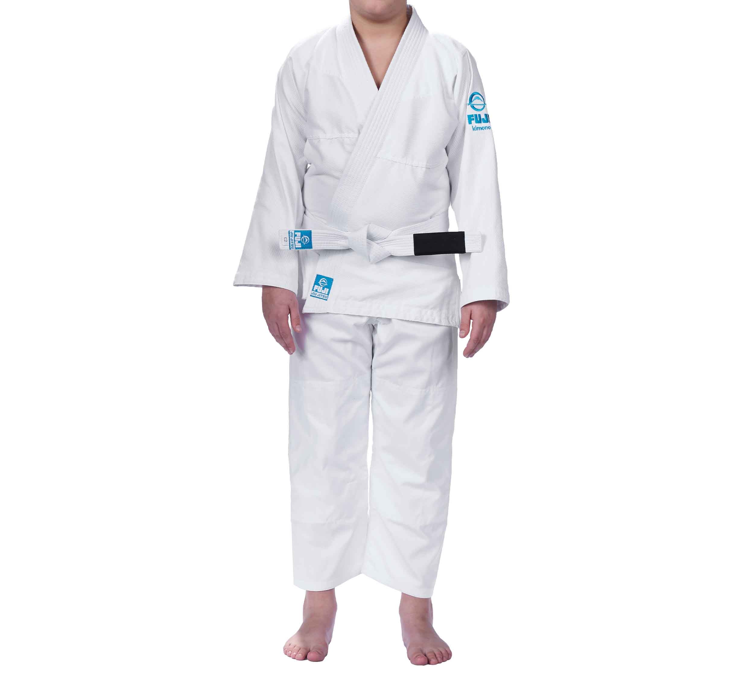 A child wearing the Starter Kids BJJ Gi White with a white belt stands barefoot against a plain white background. The head is not visible in the image.