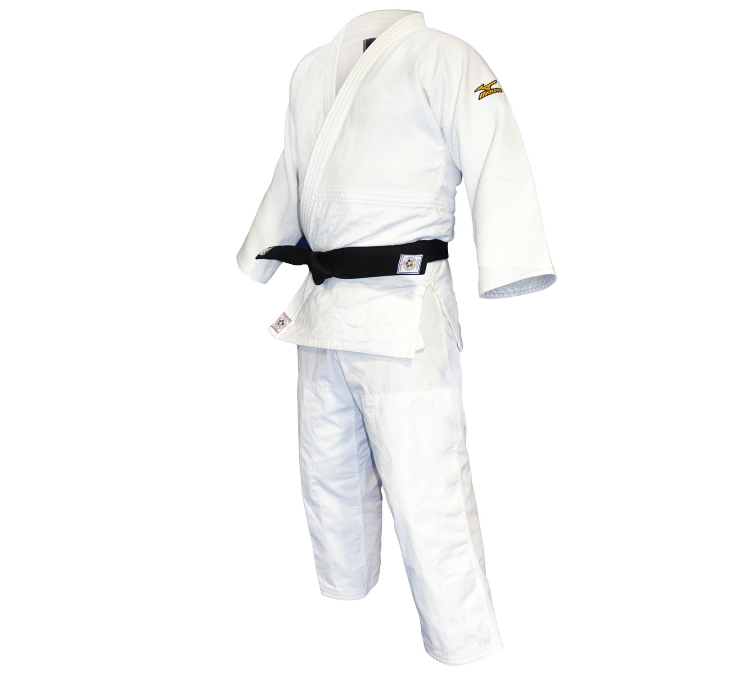The Mizuno Yusho Comp Judo Gi White, featuring a black belt, is displayed on a mannequin with slightly flared sleeves and pants, and a small yellow logo on the left shoulder.