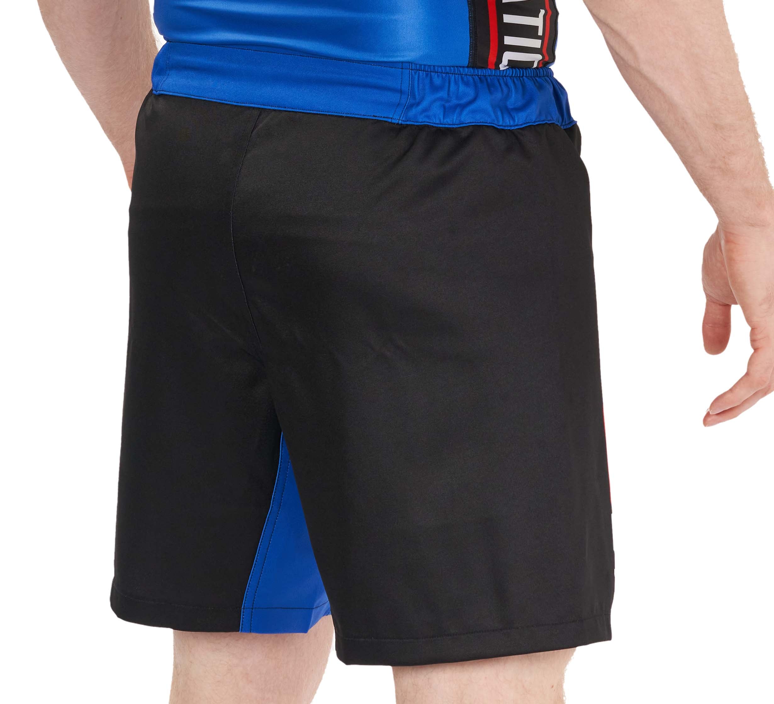 A person seen from the back wears BJJ Fanatics Lightweight Shorts Blue and a blue athletic shirt, with one arm relaxed at their side.