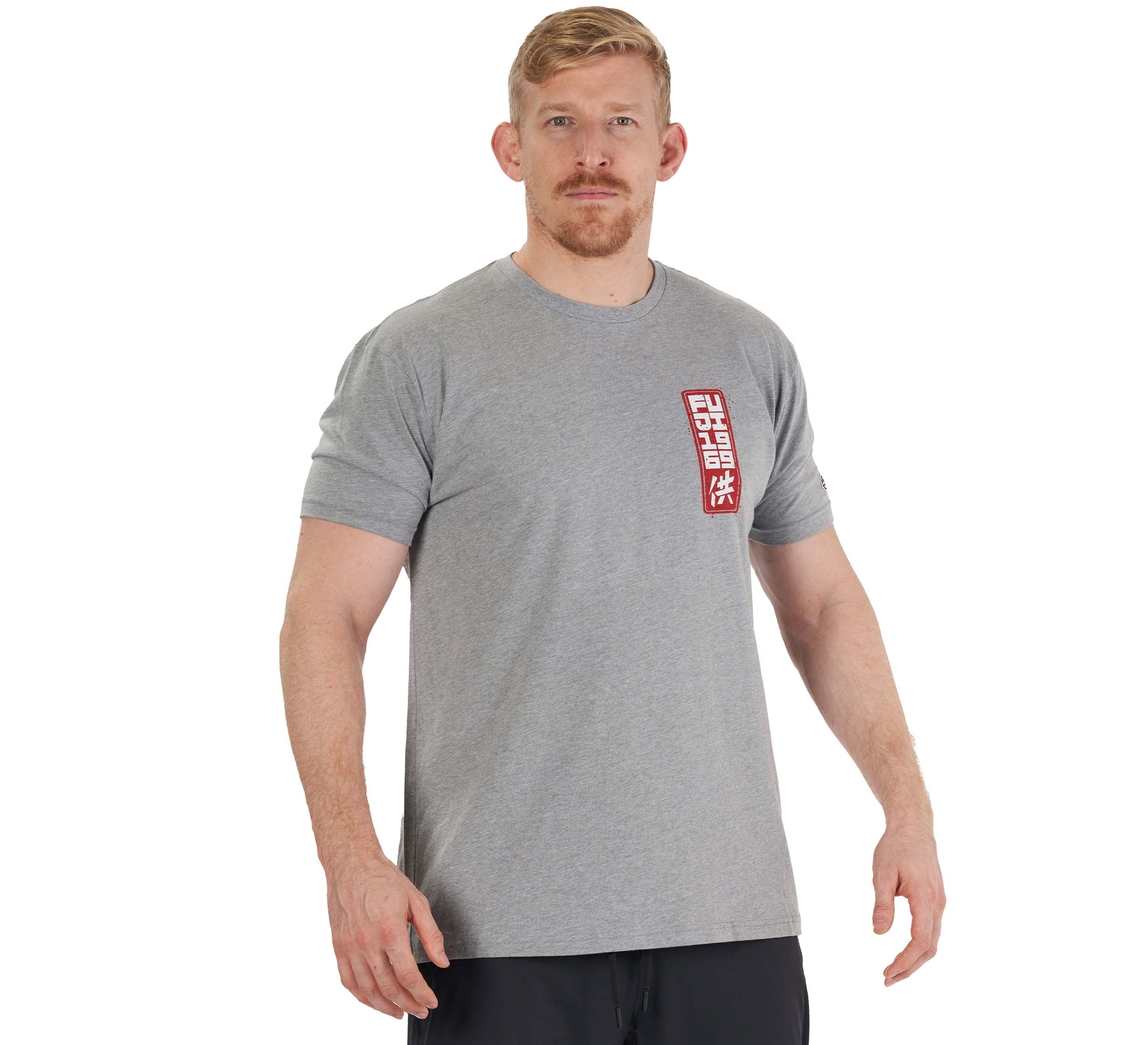 A man with short blond hair and a beard wears the Prepare For Battle T-Shirt in heather grey, featuring a red and white square design on the left chest, standing against a white background.