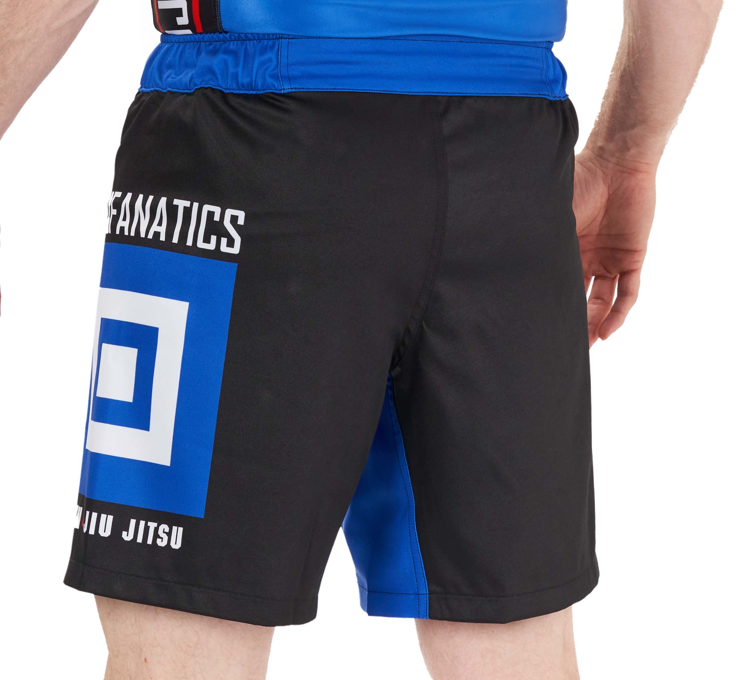 A person wearing BJJ Fanatics Lightweight Shorts Blue featuring black and blue colors, FANATICS and JIU JITSU text on the back, and a bold geometric square logo. The background is plain white.