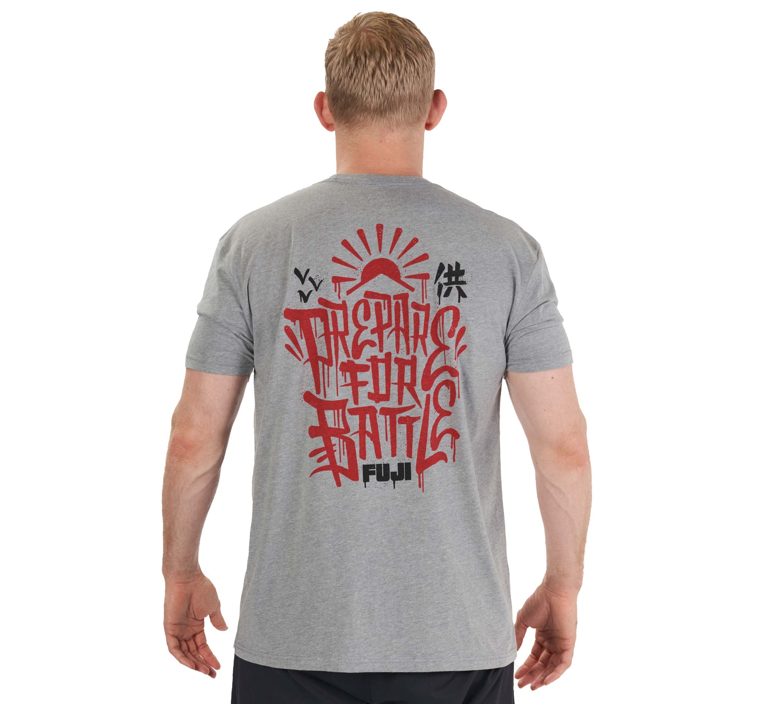 A man with short blond hair is shown from behind wearing the Prepare For Battle T-Shirt Heather Grey, featuring red and black graffiti-style graphics and the words "Prepare for Battle" and "FUJI" on the back.
