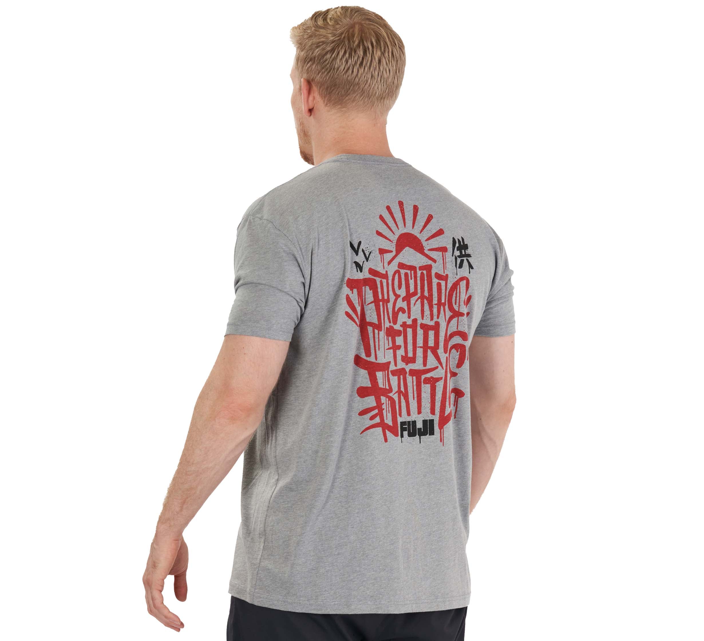A man with short blond hair is wearing the Prepare For Battle T-Shirt Heather Grey, featuring bold red and black graphic designs and text on the back, while standing and facing away from the camera.