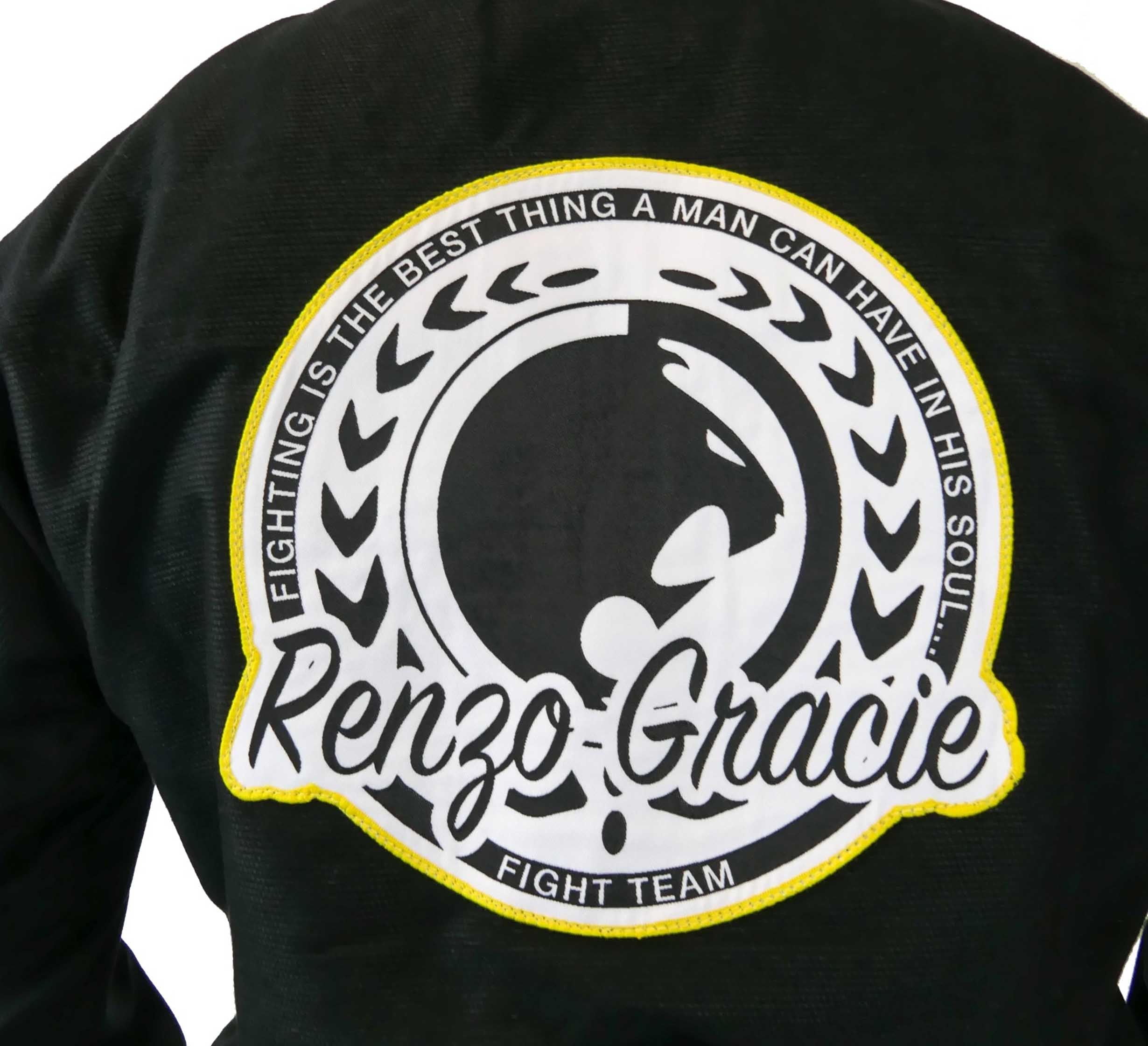 A close-up of the Renzo Gracie Superlite Gi, featuring a black jacket with a large circular patch reading “Fighting is the best thing a man can have in his soul. Renzo Gracie Fight Team,” plus laurel leaves and a face profile design.