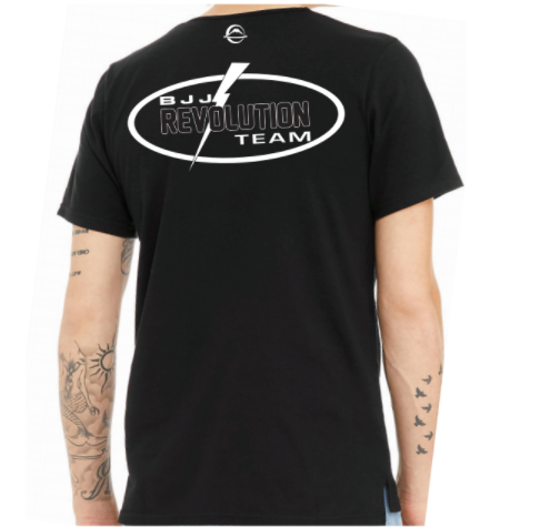 A person wears the BJJ Revolution Youth Black T-Shirt featuring a lightning bolt logo on the back, with tattoos of a sun, clouds, and birds visible on their arms.