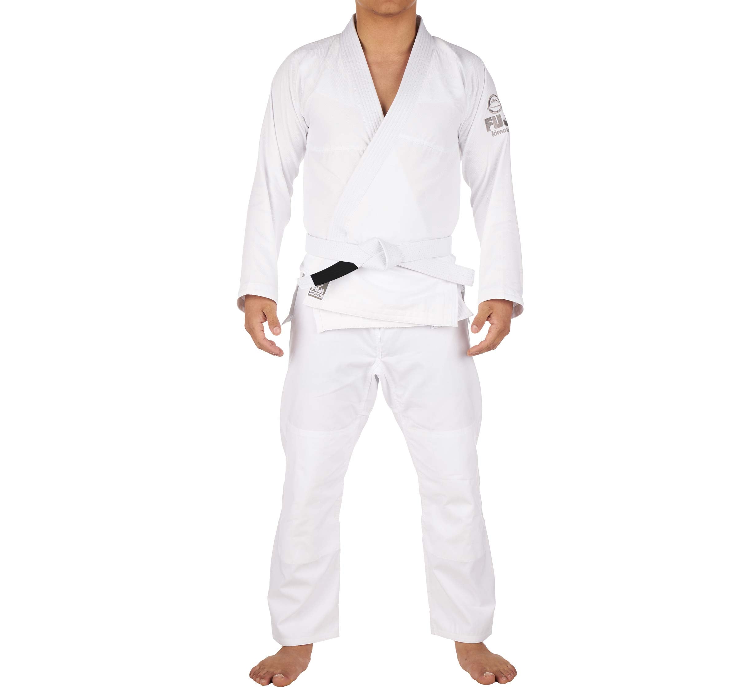 A person stands barefoot, facing forward against a plain white background, wearing the Starter Adult BJJ Gi in white with a white belt.