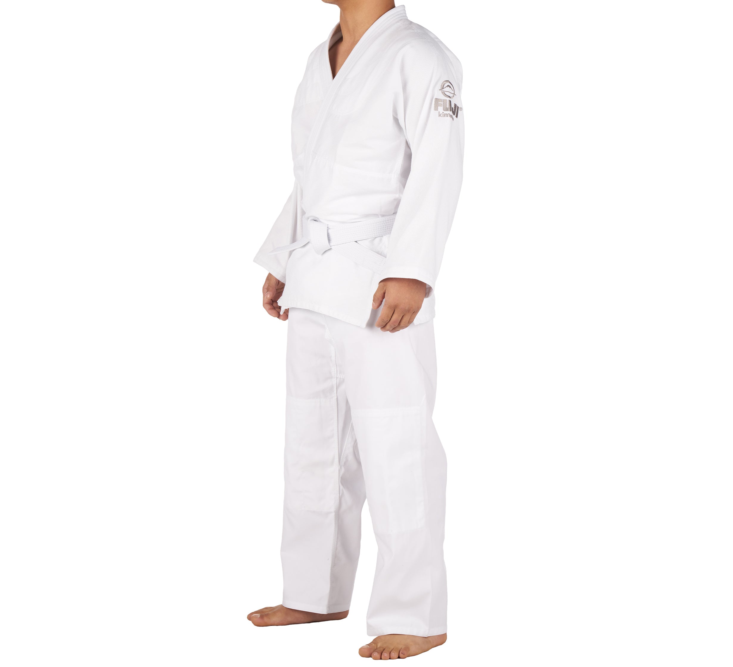 A person wearing the Starter Adult Judo Gi with a white belt stands barefoot against a plain white background. Their head is not visible.
