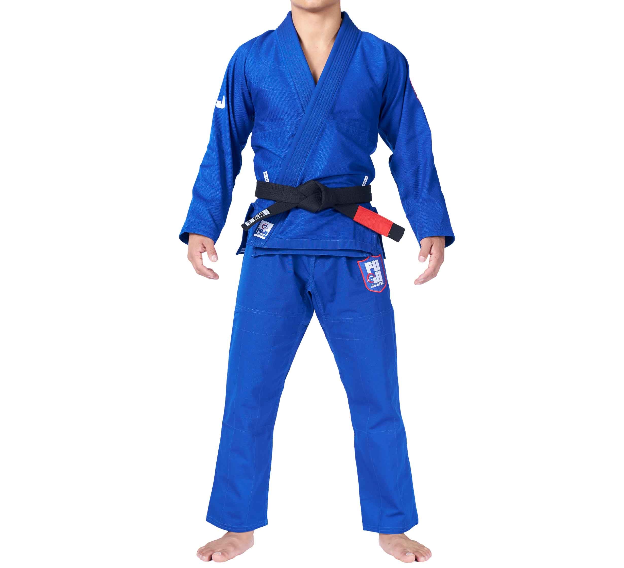 A person wearing the TRU Fit BJJ Gi Bundle (2 Items) in blue with a black belt, standing barefoot with arms at their sides and face hidden from view.