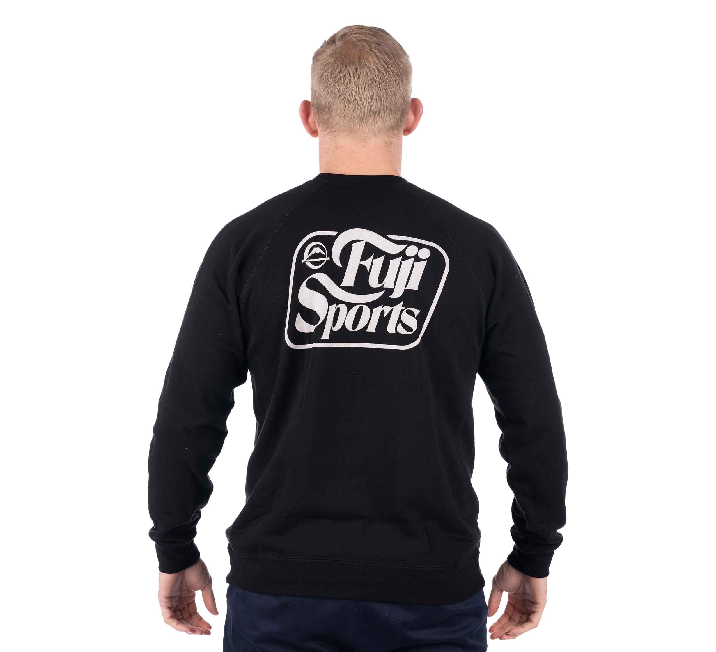 A person with short blond hair is seen from behind, wearing the Wave Crewneck Men's Sweatshirt Black with a large white Fuji Sports logo on the back.