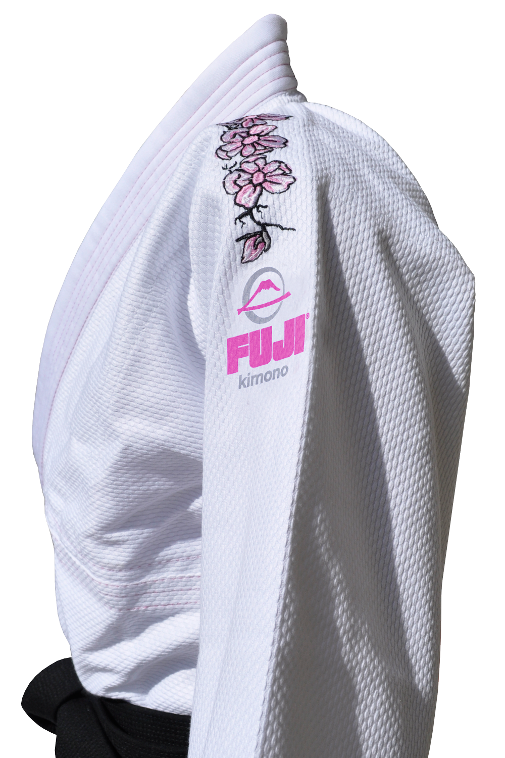 A close-up of the Blossom Kids Jiu Jitsu Gi White, featuring a pink FUJI mountain logo and embroidered cherry blossoms on the sleeve, with a black belt at the waist.