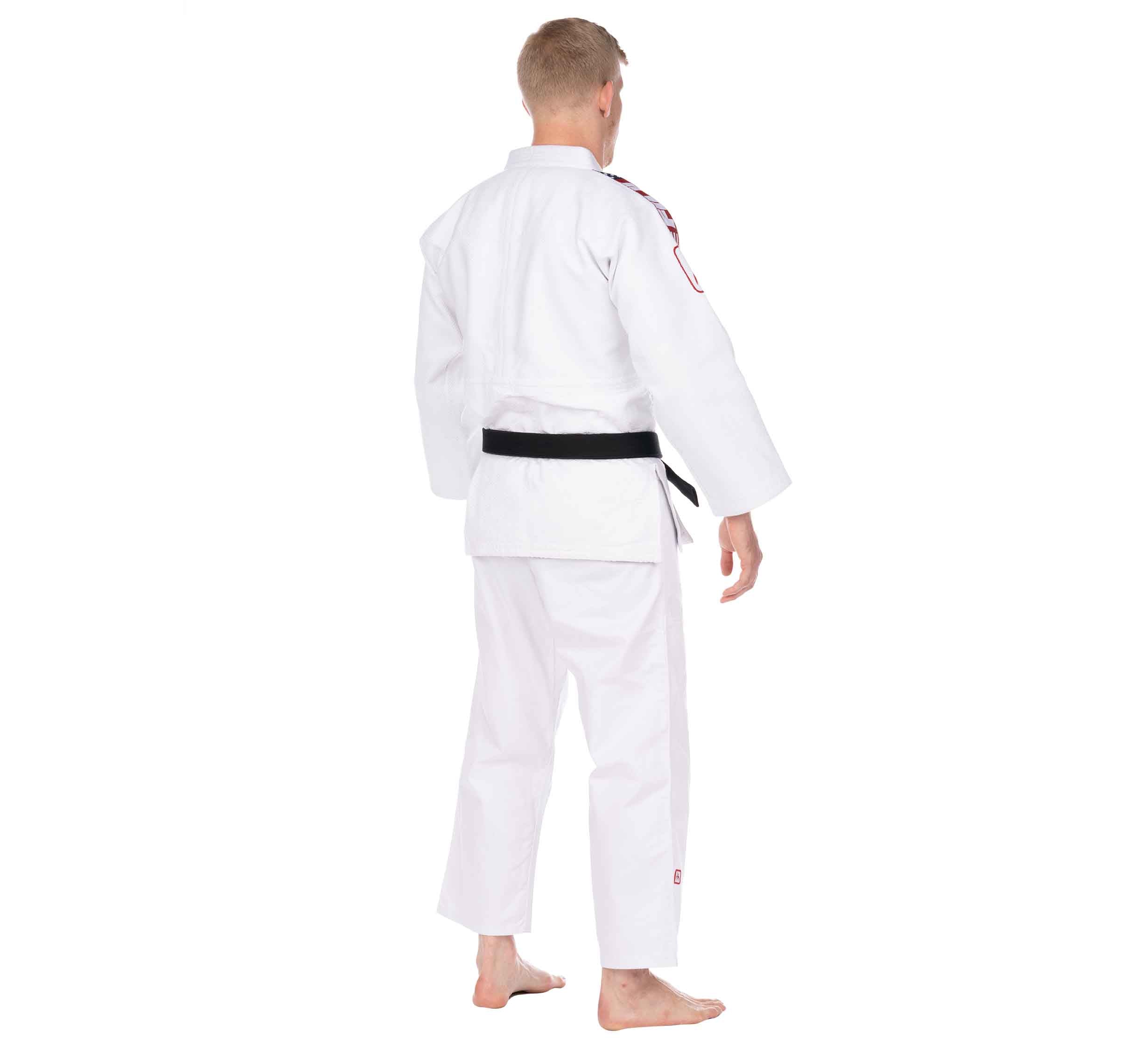 A person in a white USA Judo Double Weave Gi 2.0 stands barefoot, facing away to show the back of the uniform and black belt against a plain white background.