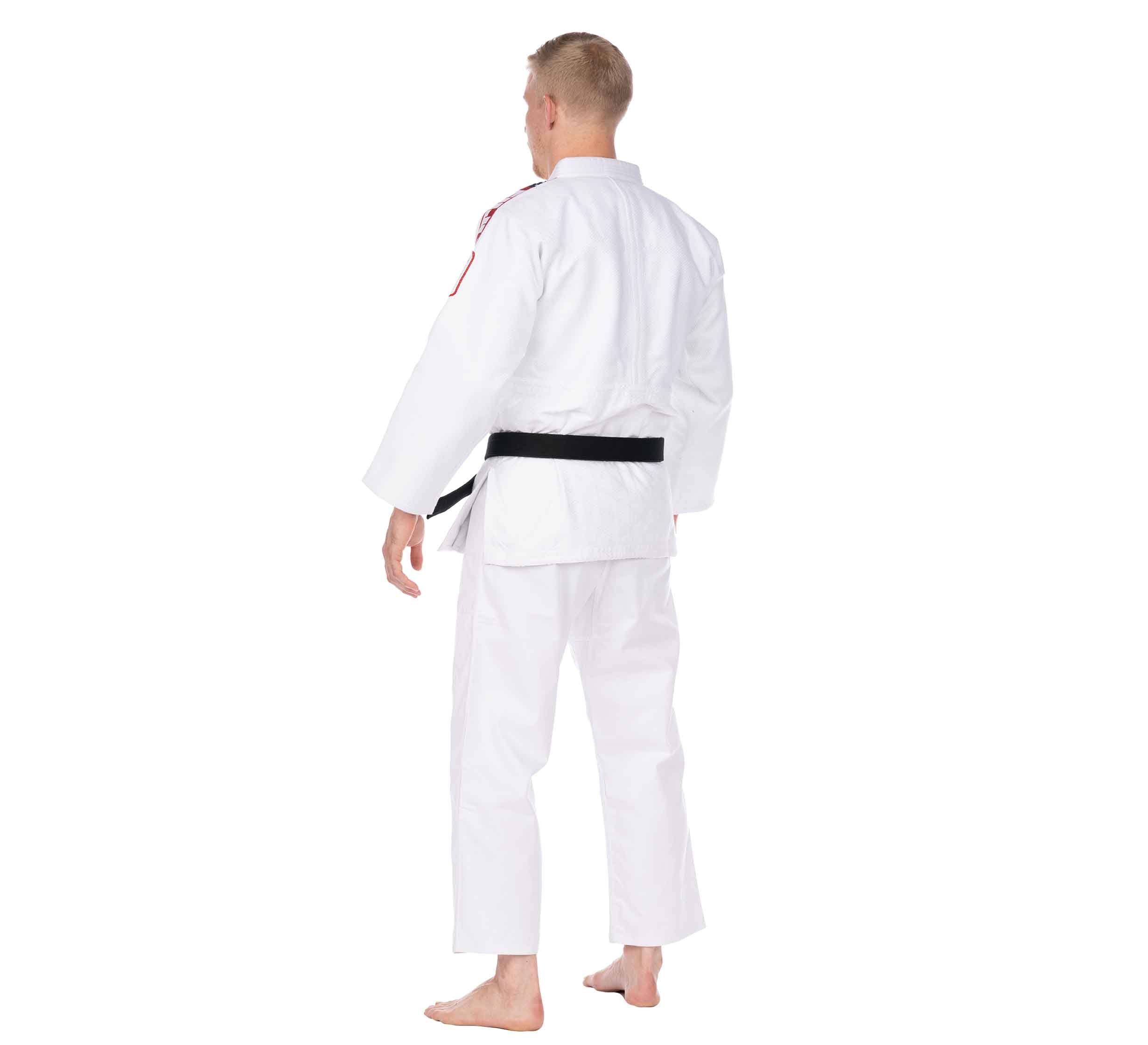 A person models the USA Judo Double Weave Gi 2.0 White with a black belt, standing barefoot and facing away from the camera on a white background.