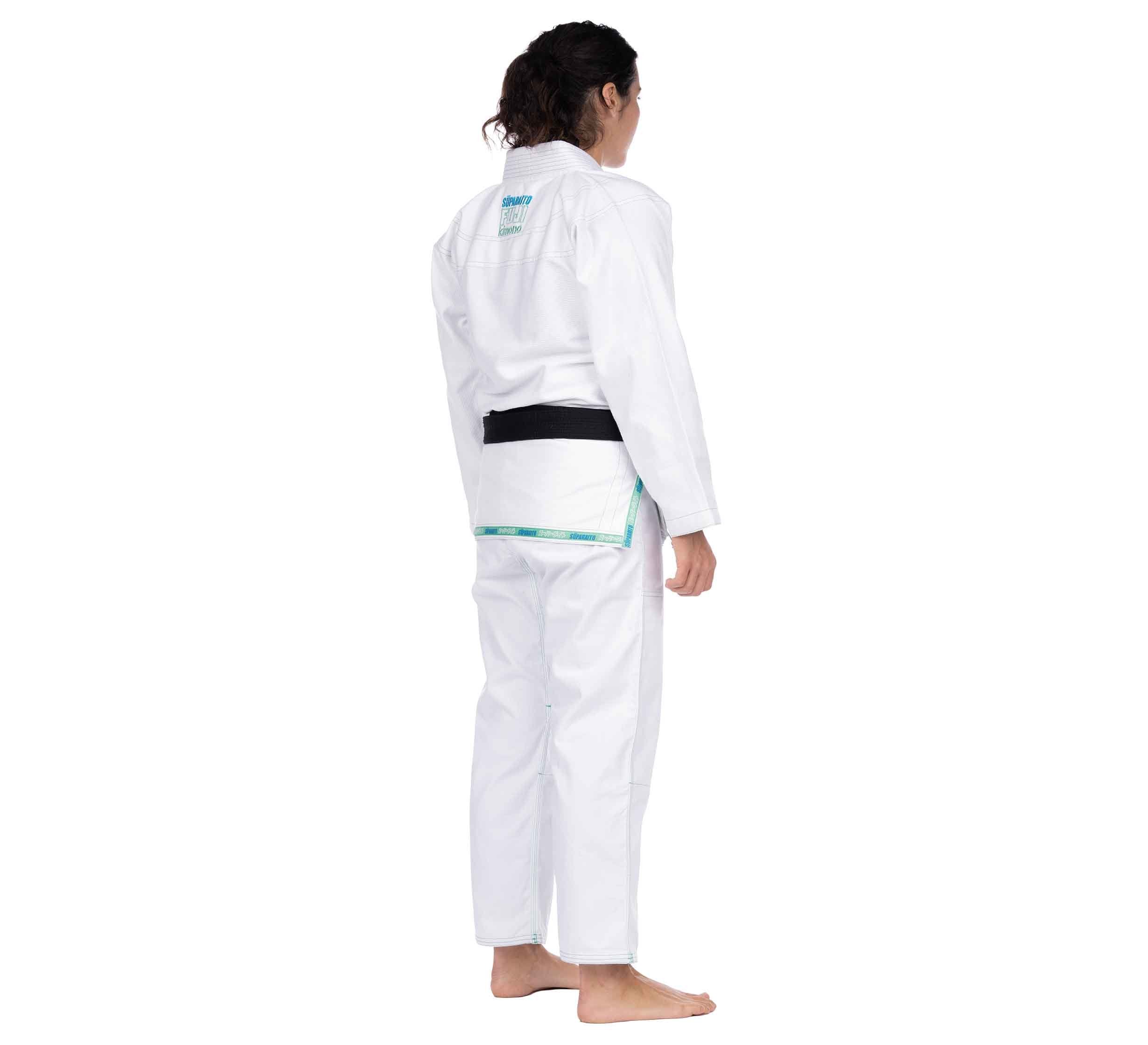 Person wearing the Suparaito Girl's BJJ Gi in teal stands barefoot, facing away, against a plain white background.