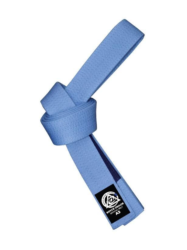 A Royce Gracie OFFICIAL Blue BJJ Belt with Blue Bar, tied in a knot, featuring a black label with a white logo and the text Royce Gracie Jiu-Jitsu.