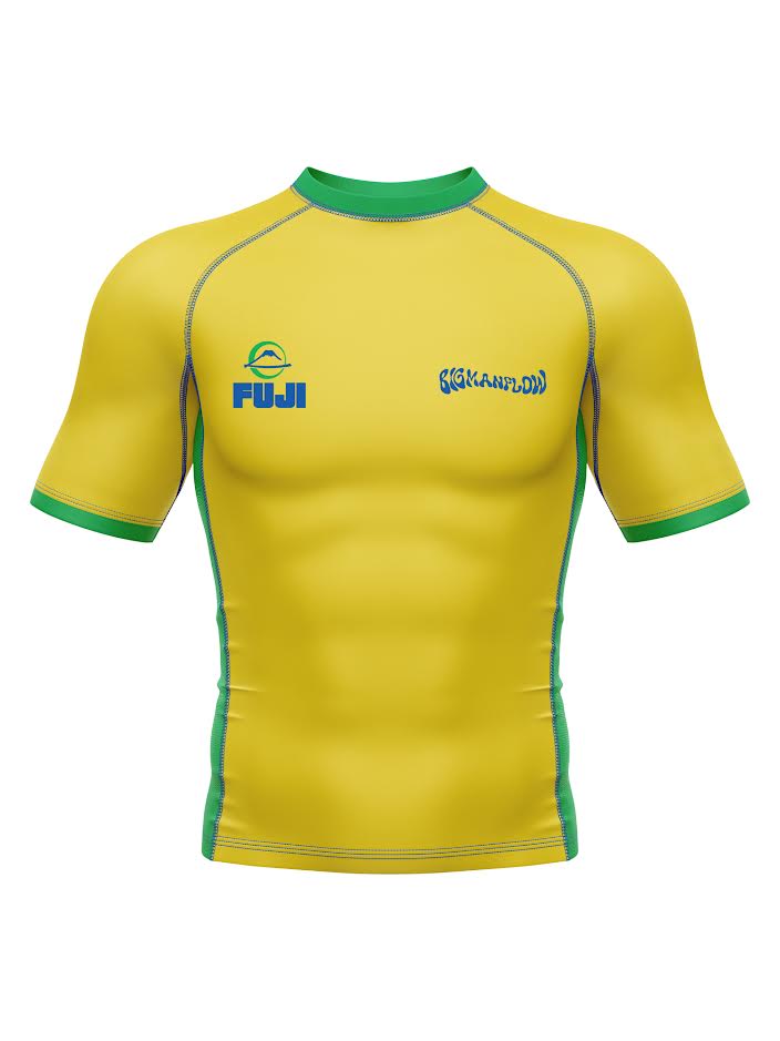 Big Man Flow Brazil Short Sleeve Flex Lite Rashguard, a yellow short-sleeve compression shirt with green trim, featuring a logo on the left chest and text on the right chest.