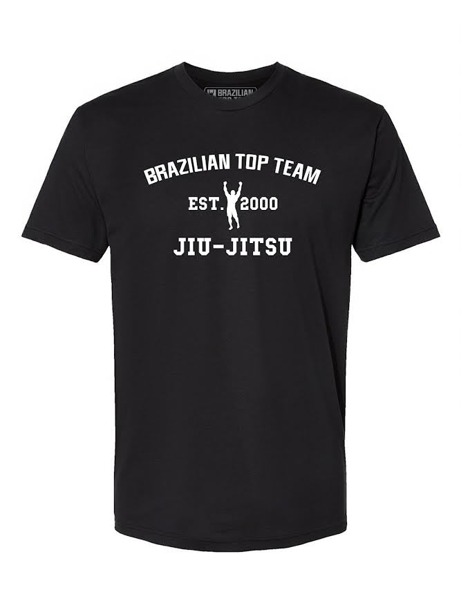 BTT Collegiate Black T-Shirt ADULT featuring white text that reads “BRAZILIAN TOP TEAM EST. 2000 JIU-JITSU” and a small silhouette of a person raising their arms below the text.