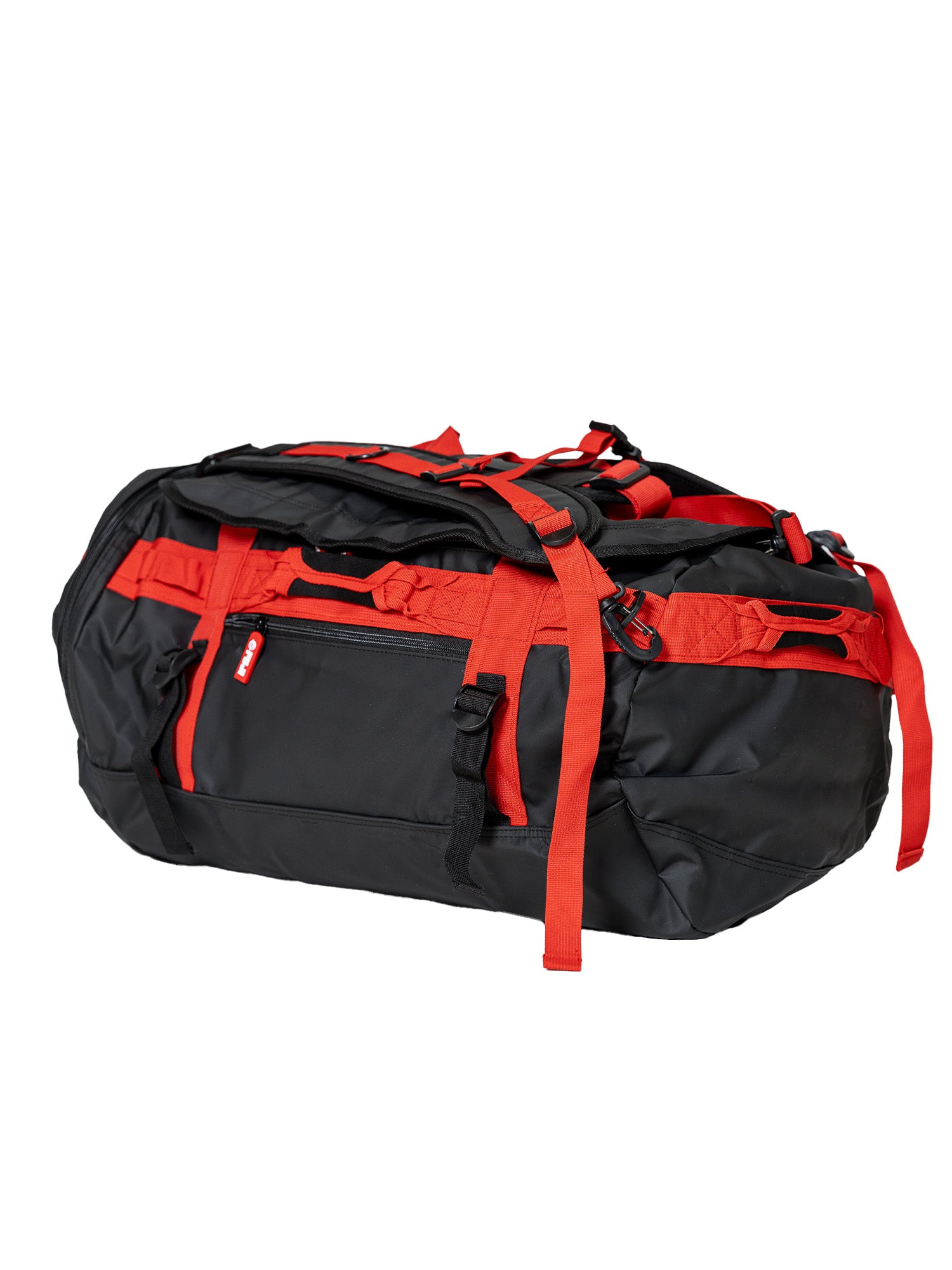 The Comp Duffle Black Red is a spacious black bag with bold red straps, multiple pockets, and adjustable buckles.
