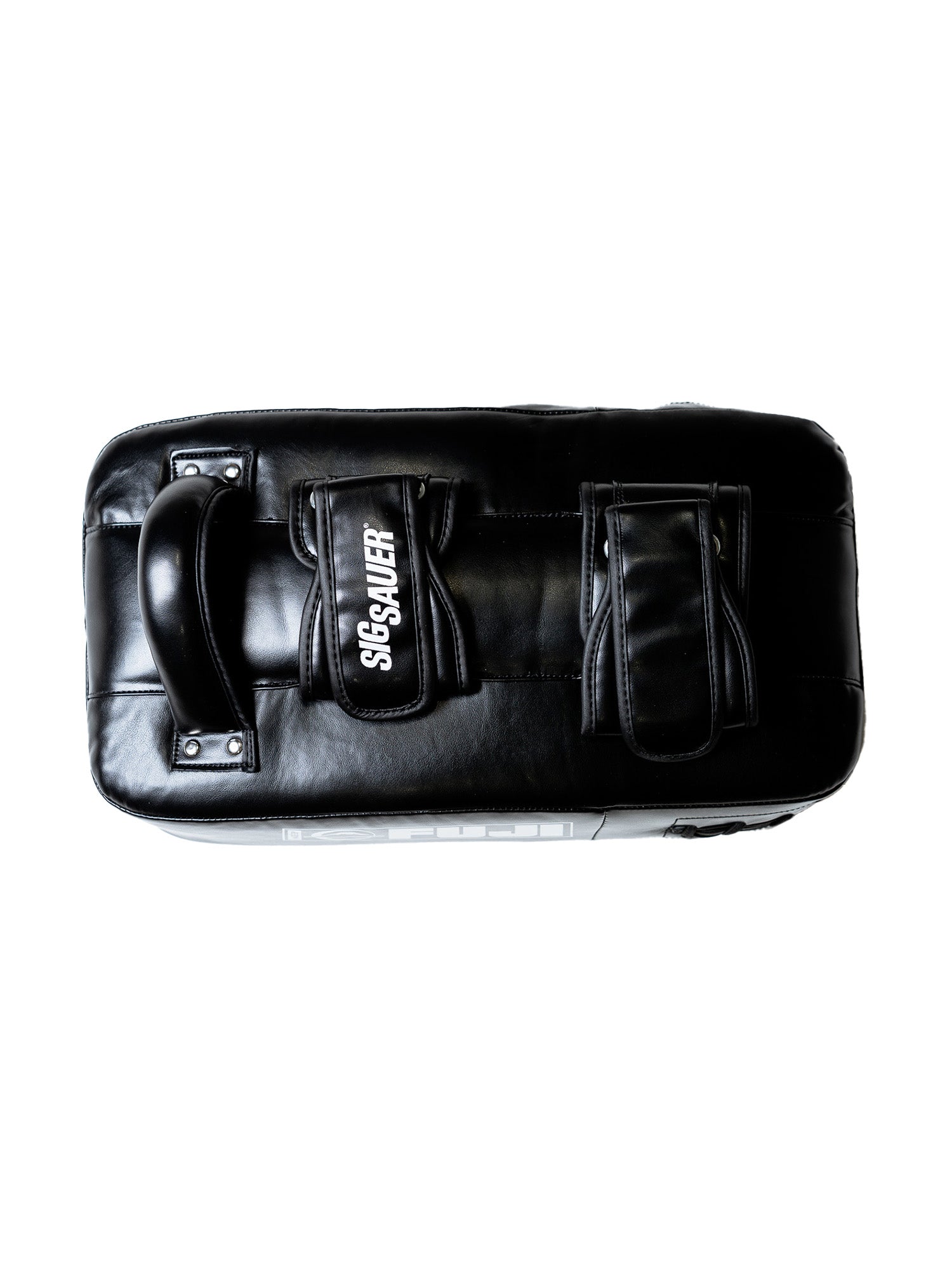 A pair of Sig Sauer Thai Pads with two exterior pockets, one labeled SIG SAUER, is shown in black leather from above on a white background.