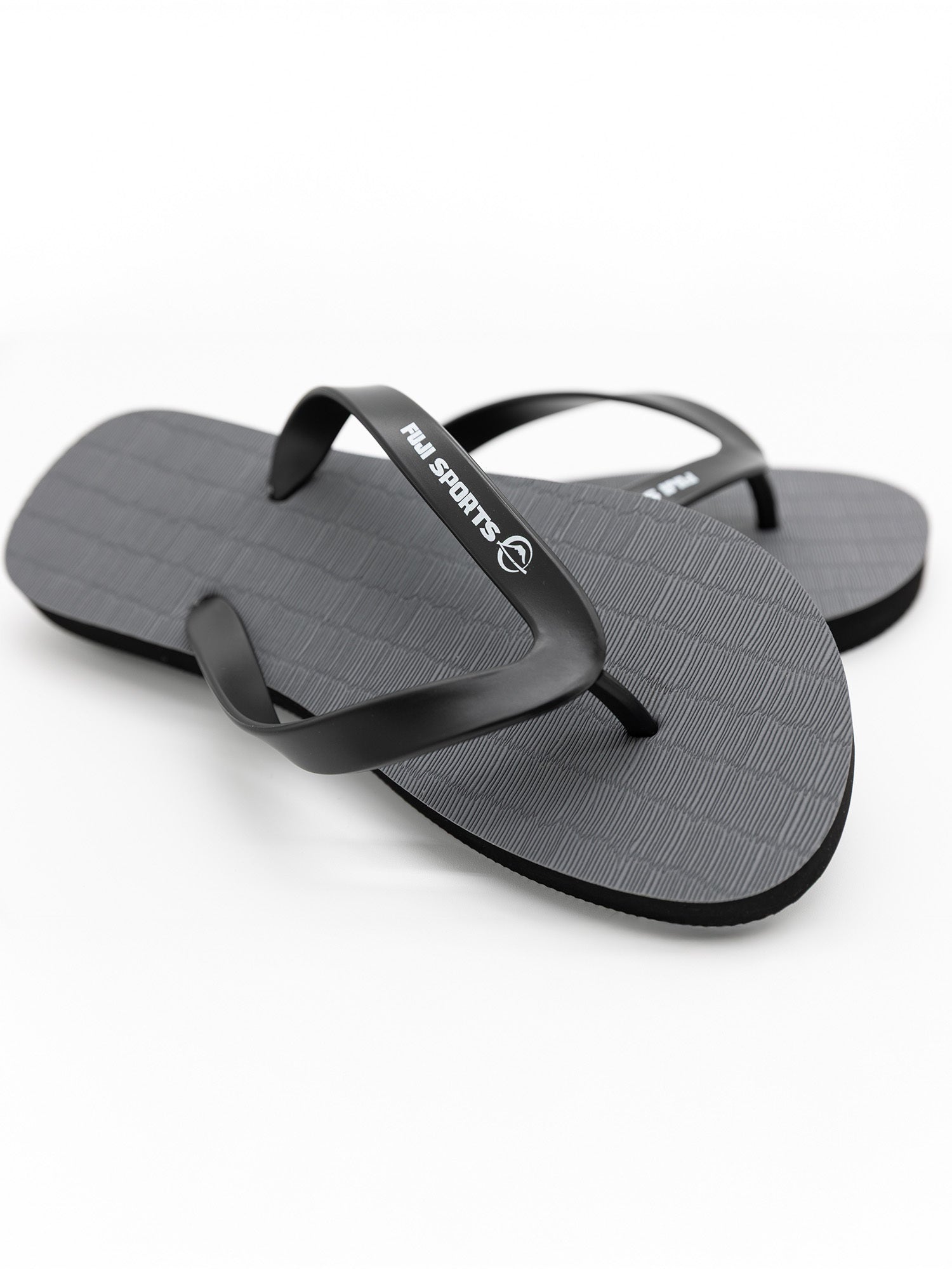 A pair of FUJI Authentic Tatami Sandals in grey, featuring textured soles and FUJI branding on the straps, displayed on a white background.