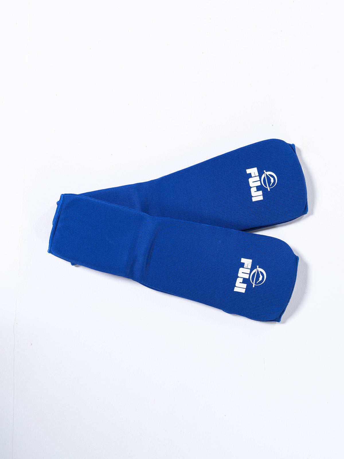 A pair of FIAS Sambo Combat Shin Guards in blue, each featuring the FUJI logo in white, displayed on a white background.