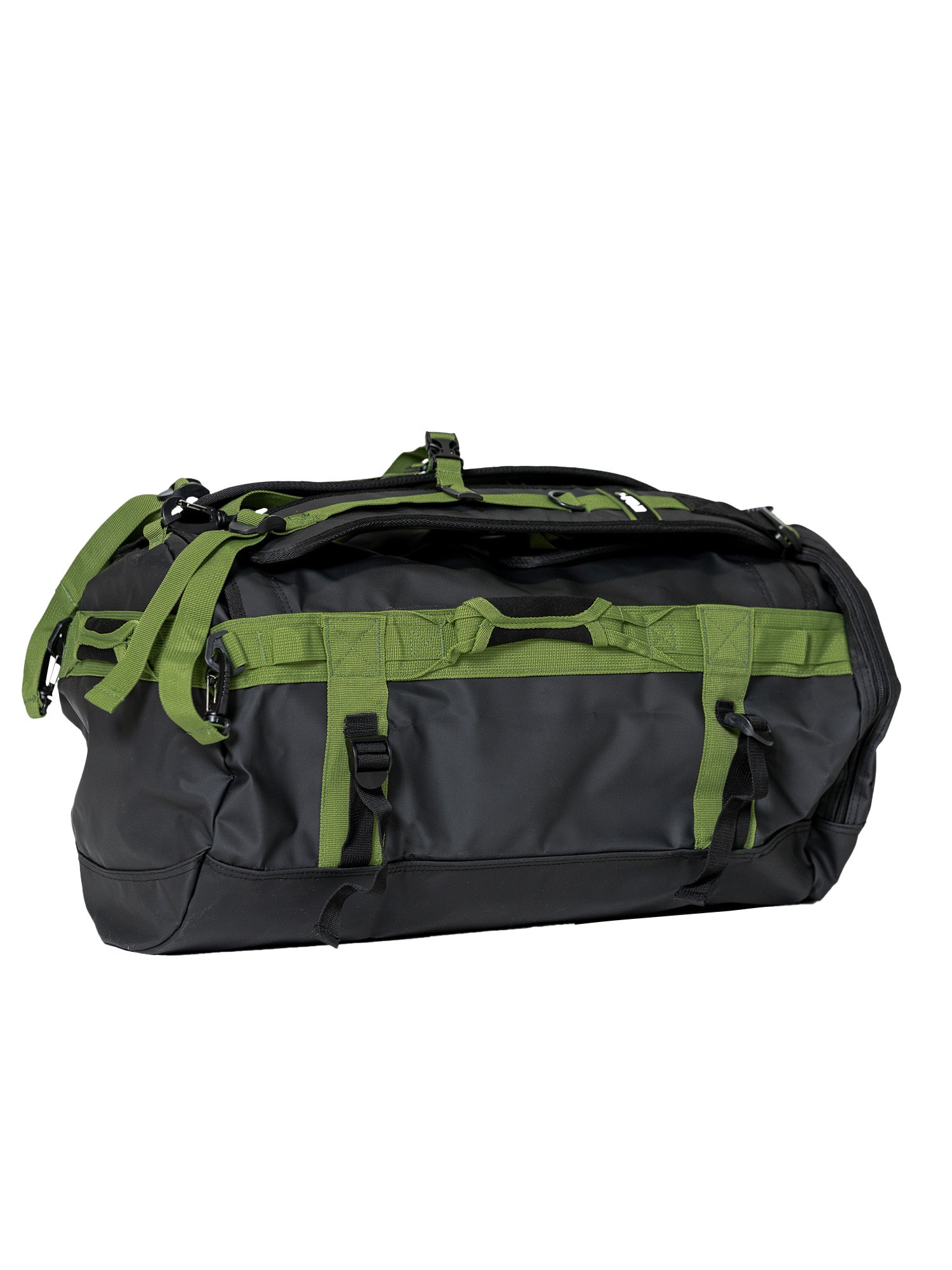 The Comp Duffle Black Green is a large black duffel bag with green straps and handles, featuring multiple buckles, zippers, and reinforced seams for durability, displayed against a white background.