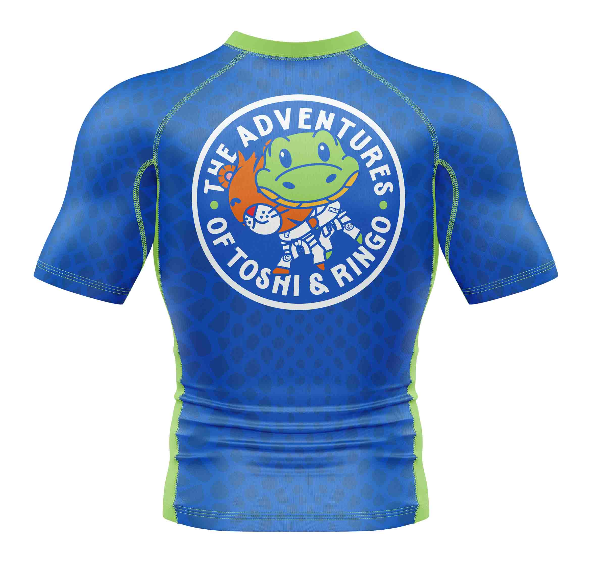 The Ringo Rashguard Blue/Green is a short-sleeve athletic shirt with green trim, featuring a circular back logo that says "The Adventures of Toshi & Ringo" around a cartoon frog in a spacesuit waving with a cat.