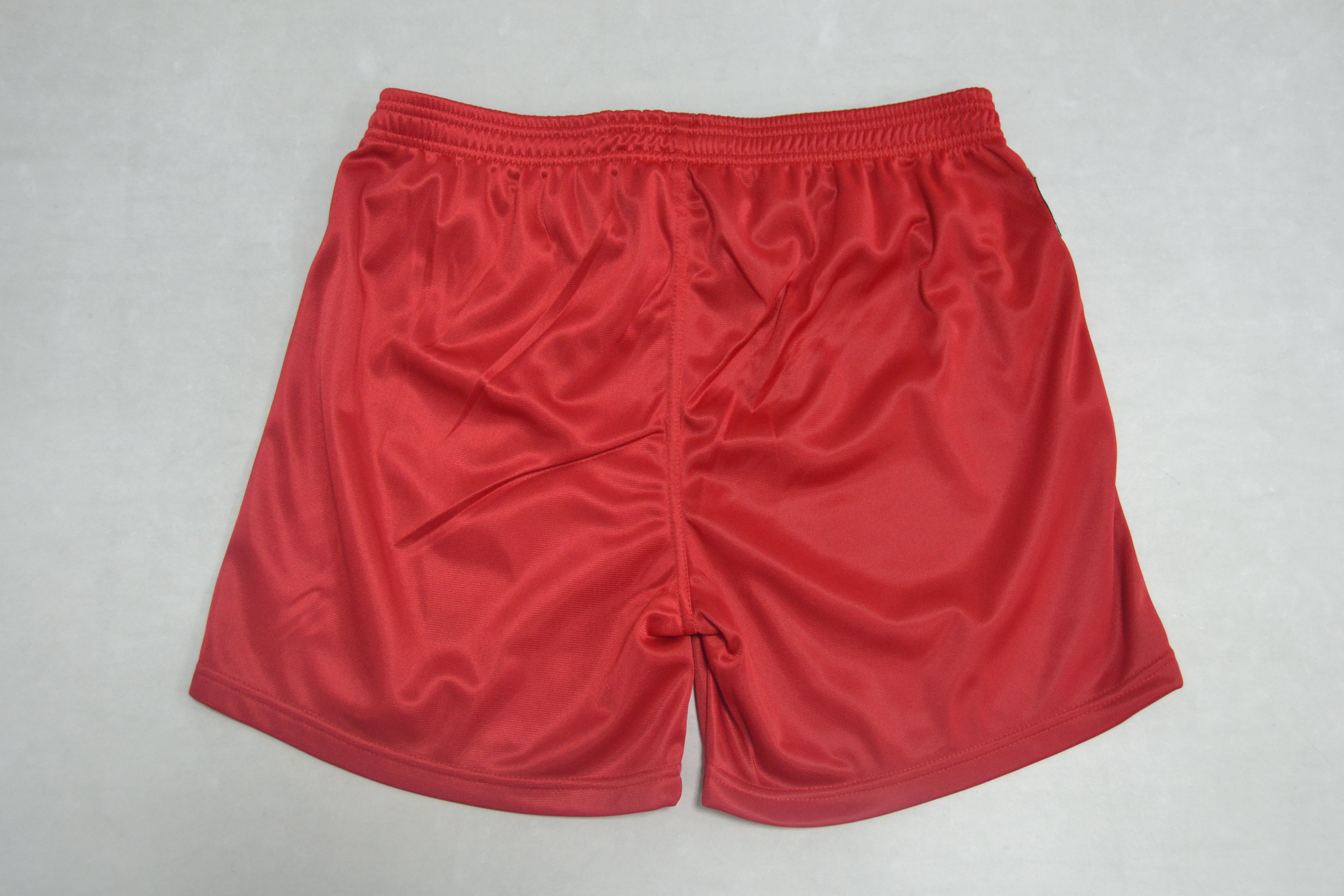 A pair of FIAS Sambo Shorts Red, featuring an elastic waistband, displayed flat against a plain light grey background.