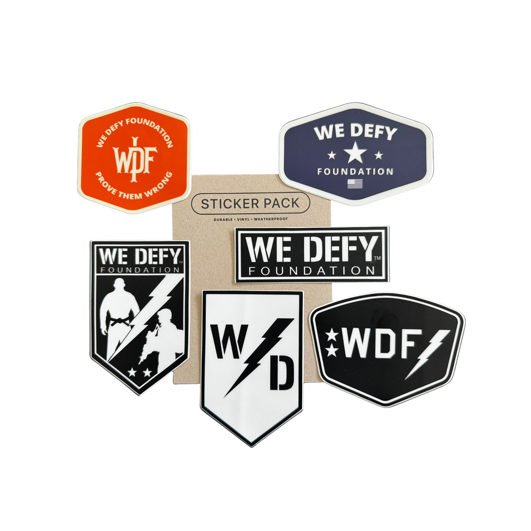 The We Defy Foundation 6 Pack Stickers Multicolor features six stickers with vibrant logos in assorted shapes, displayed around a brown card labeled "Sticker Pack" on a white background.